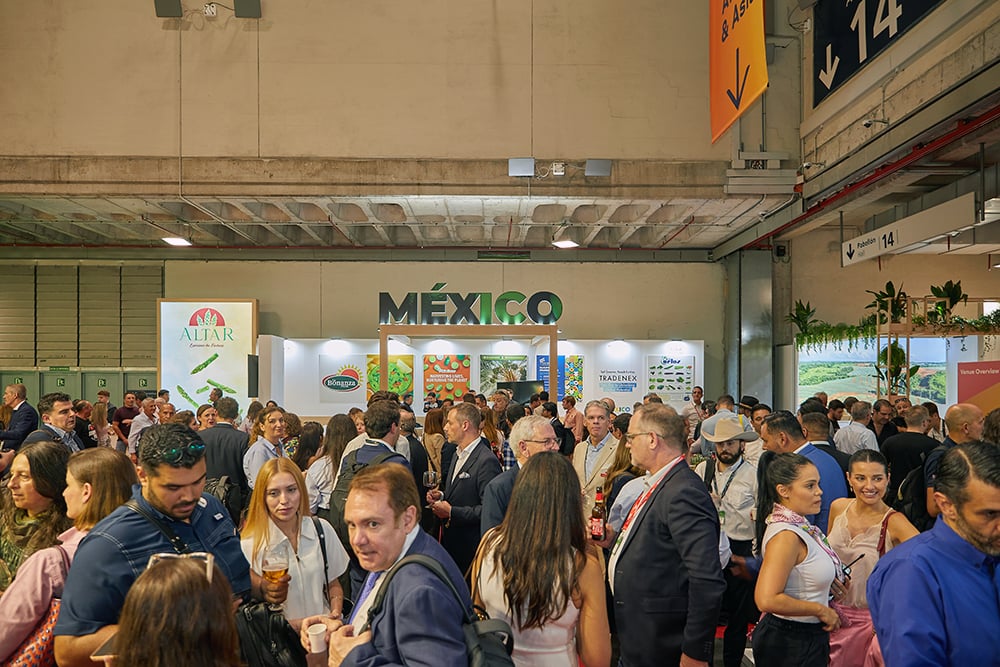 Large group of people congregated outside the Mexico Pavilion. 