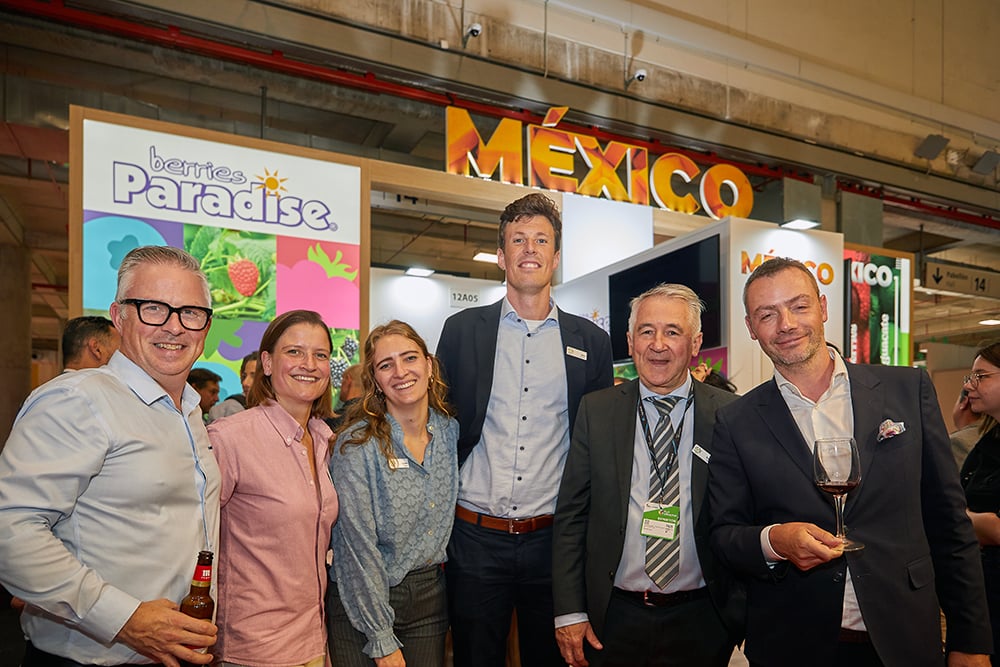Posed photo of 6 men and women during a convention