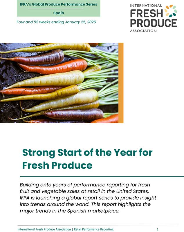 Cover page of a produce report featuring colorful carrots and text about fresh produce trends in Spain.