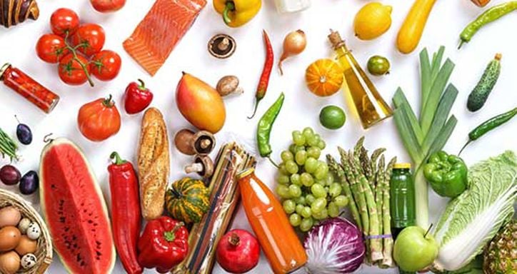 A variety of organic foods, including fruits, vegetables, and other items, arranged with the word "ORGANIC" spelled out at the top.