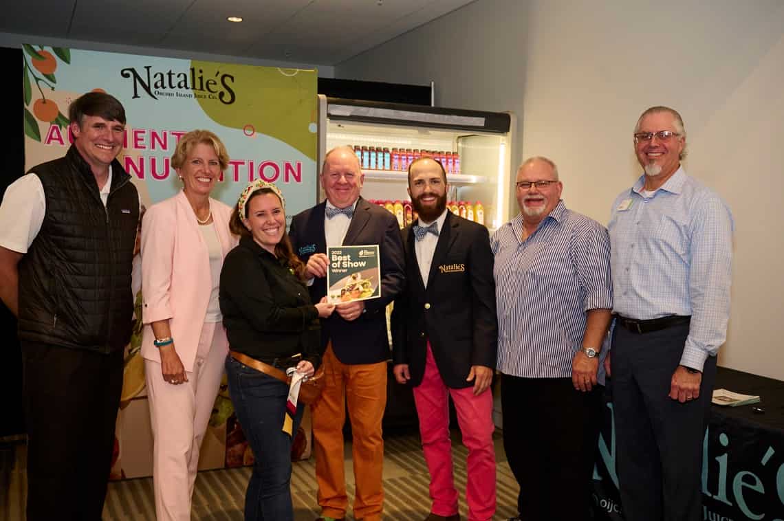 Representatives from Natalie's accepting their marketing award at the 2022 Foodservice Conference