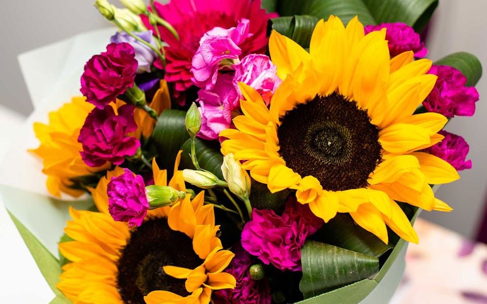 Sunflower spring bouquet. Flower arrangement of various flowers in different vivid colours.