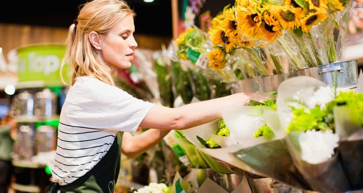 Grocer working in florist section