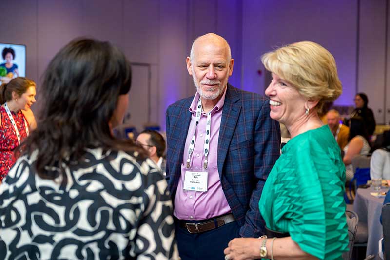 Cathy Burns, CEO of the International Fresh Produce Association, speaking in the crowd at the Produce for All Leadership Summit.