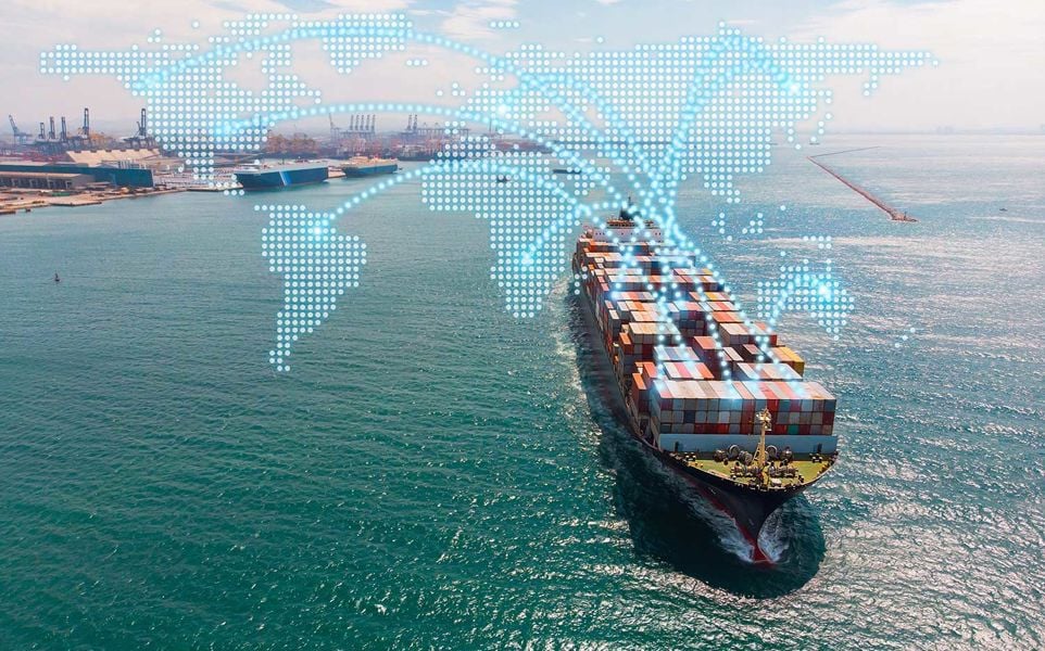 Cargo ship with multicolored containers, overlaid with a world map and trade route lines.