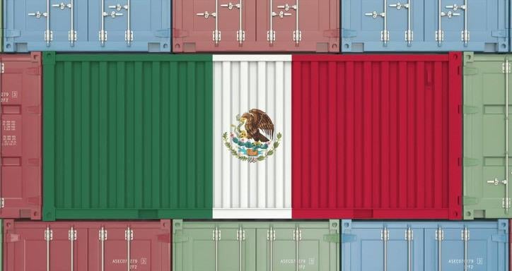 Many shipping containers stacked on top of each other with the middle three containers making the Mexican flag