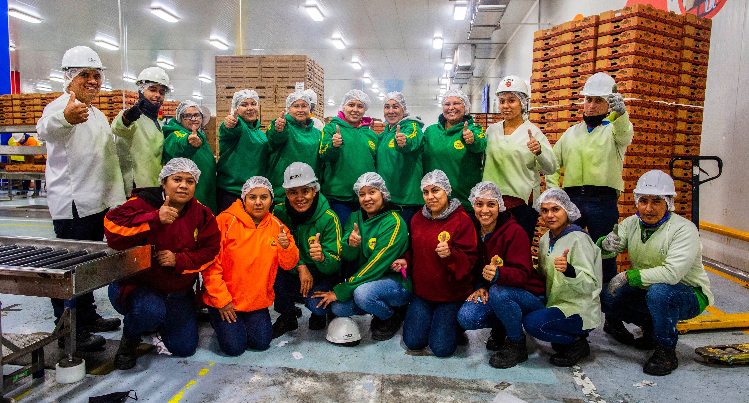 Employees of Nature Sweet pose for group picture.