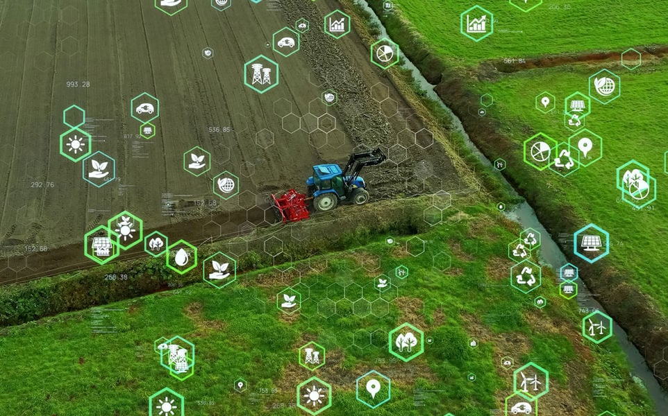 Aerial view of a field with a tractor plowing, overlaid with green hexagonal icons depicting agricultural technology.