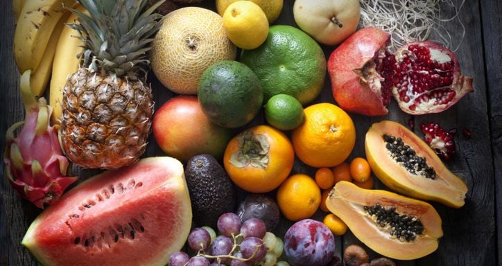Exotic fruits variety still life on vintage wooden boards
