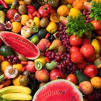Various types of fruits and vegetables laid out in a pile