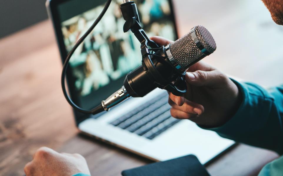 Male hand grabbing microphone