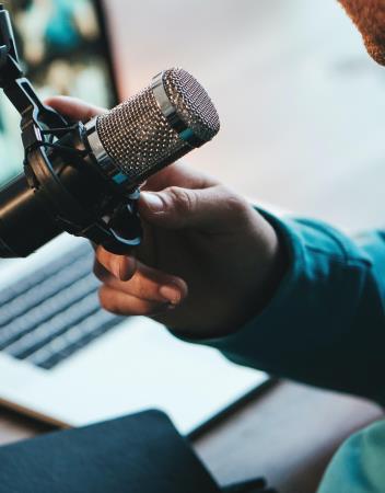 Male hand grabbing microphone